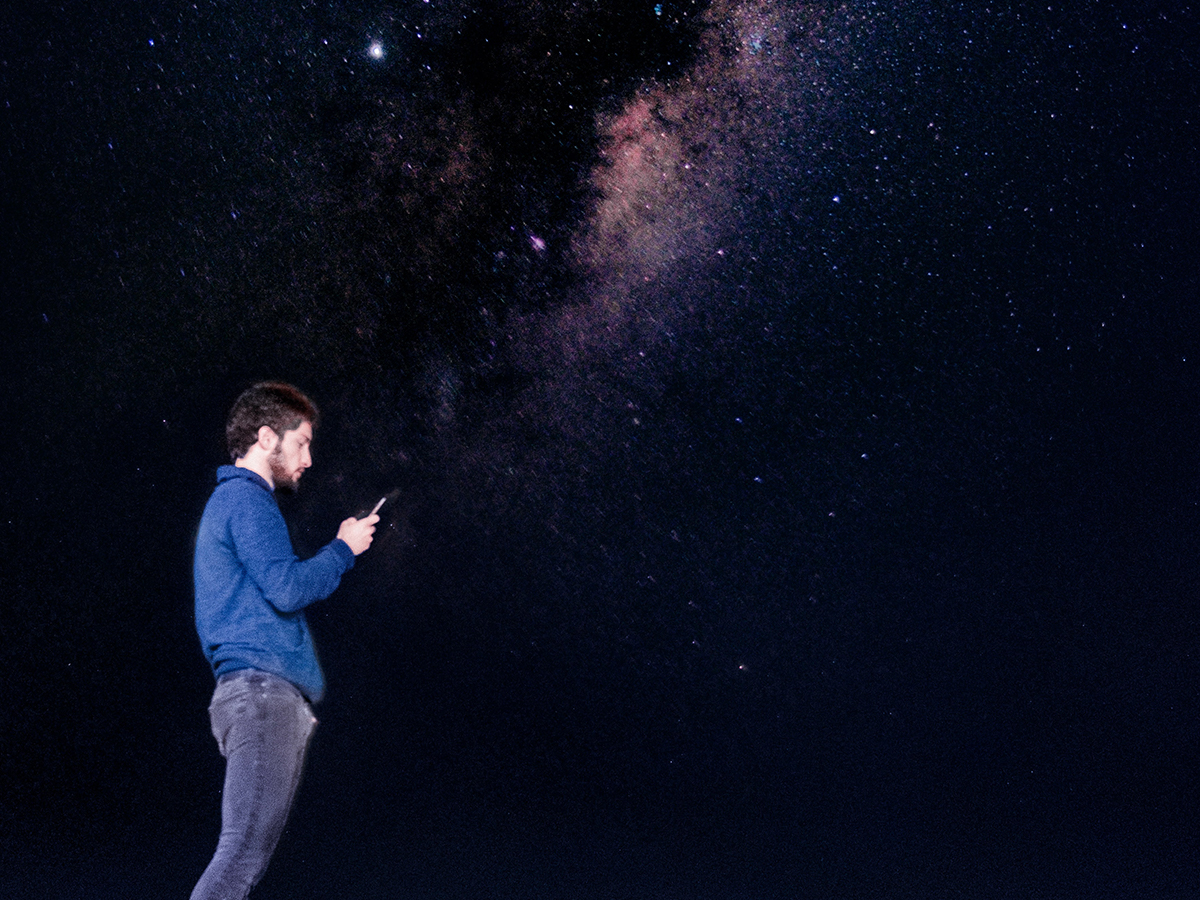 man on phone alone at night