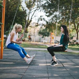 two women on swings