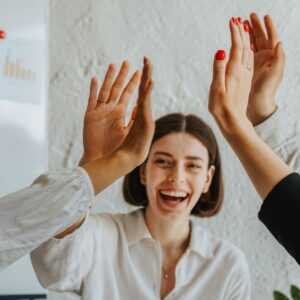 person in a group high five