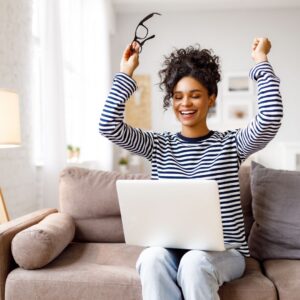 person on computer that is excited