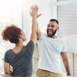 Two people high fiving
