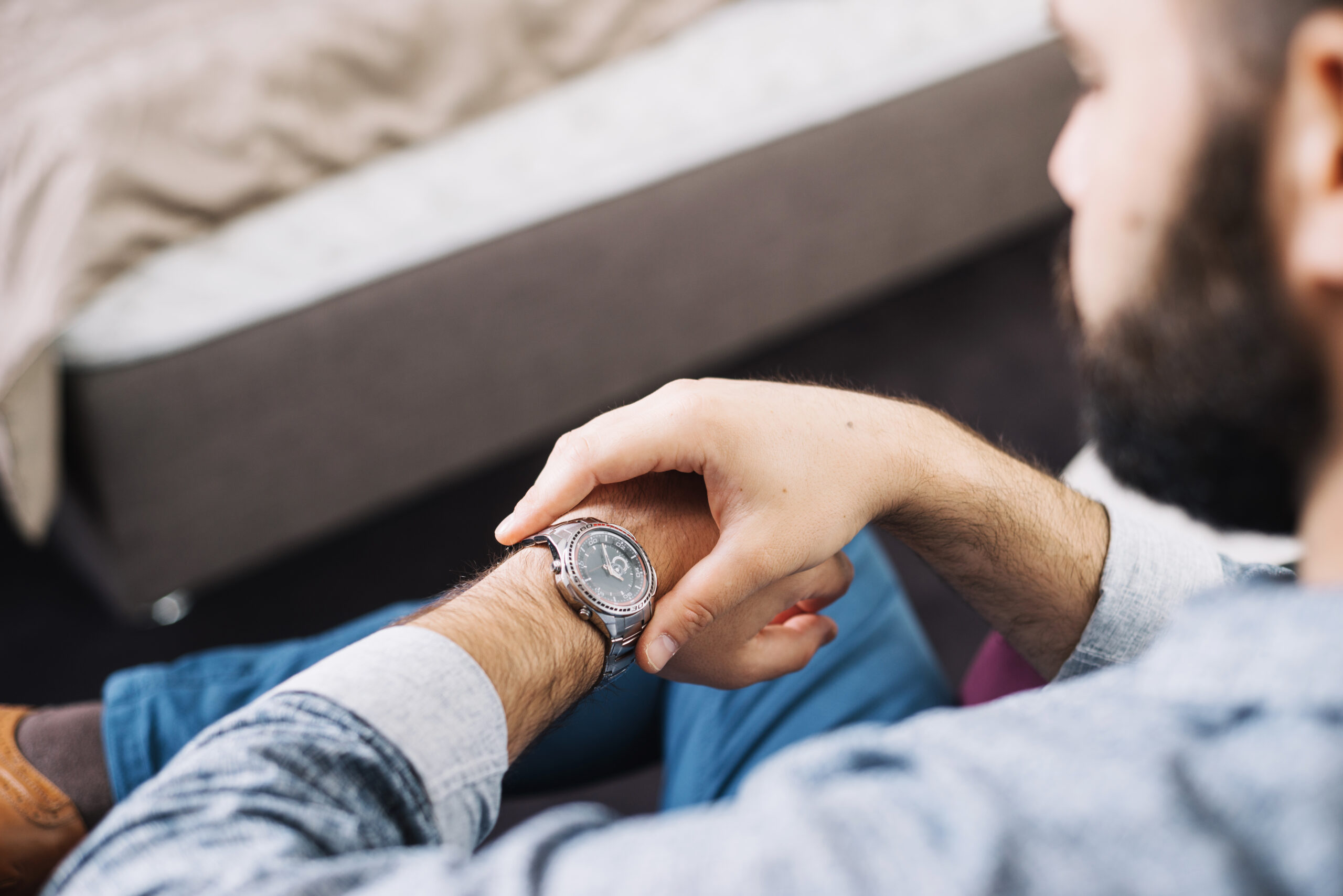 image of a man checking his watch