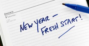 "new year fresh start" on a notepad